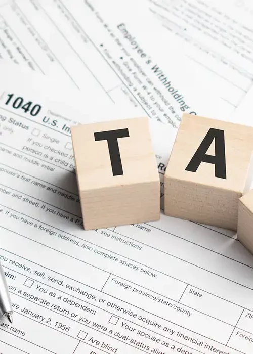 Does overtime get taxed more? Tax forms in a desk