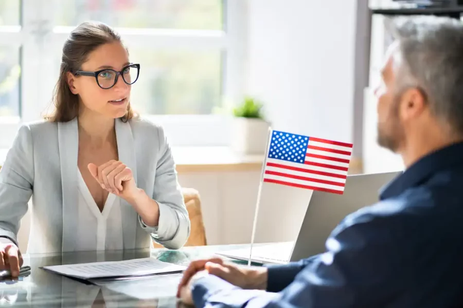 immigration lawyer talking with a client to speed up his process