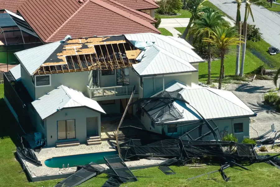 Property Damage Lawyer inspecting damaged home